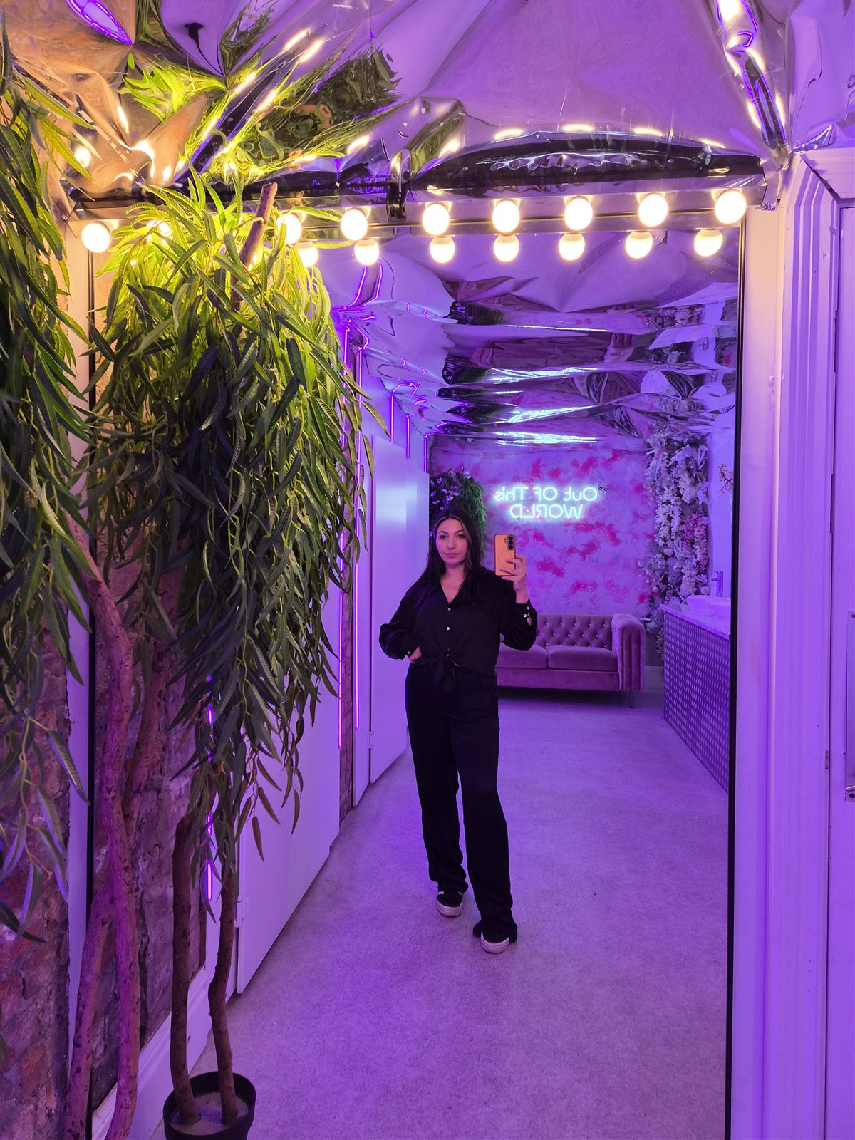 A mirror photo in the purple-lit dressing area.